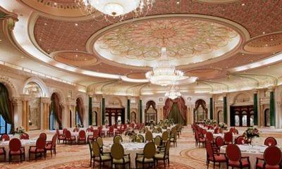 Magnificent ballroom set up with round, banquet-style tables and seating