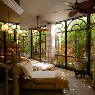 With day beds and floor-to-ceiling windows filtering sunlight and foliage views, the spa is like a garden room for the soul.