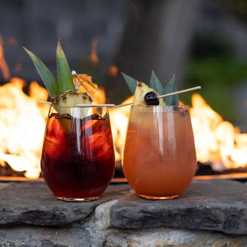 Two cocktails near the fire pit