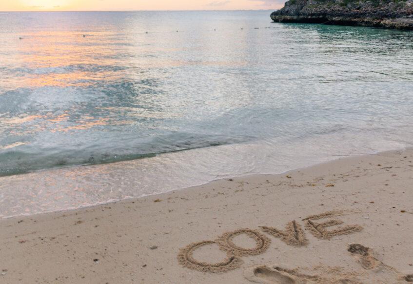cove written on the sand