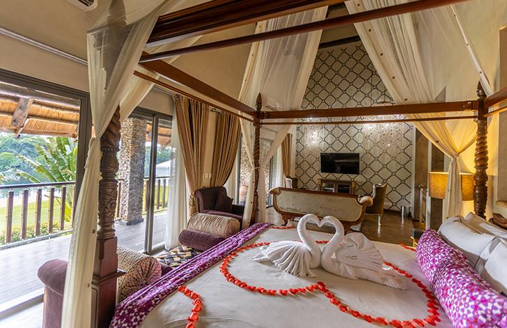 View of the four poster bed in The Picathartes Presidential Suite at The Royal Senchi Hotel & Resort, Ghana
