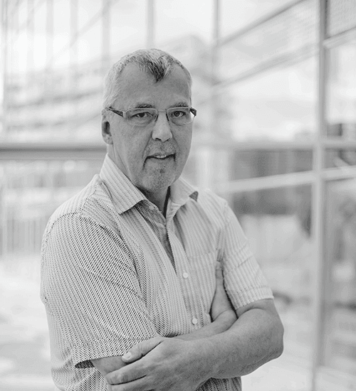 Portrait of Martin Kreidl, Technical Event Manager at VIECON, photographed in a professional black-and-white setting.