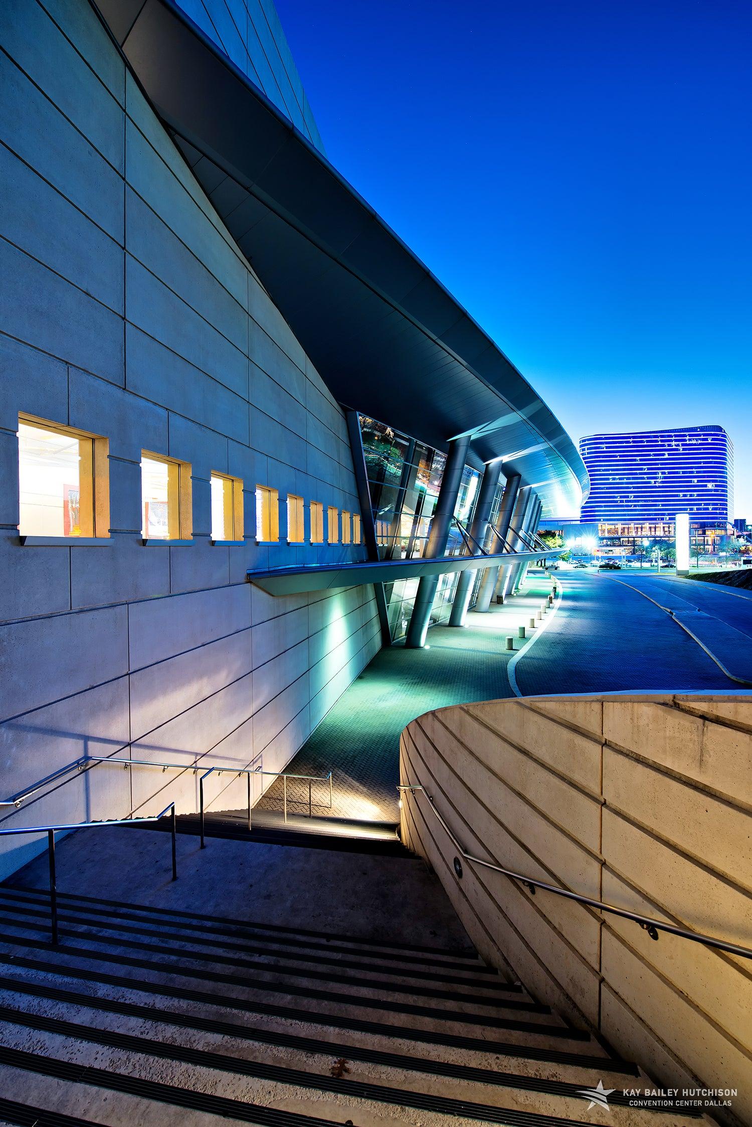Nighttime view of Kay Bailey Hutchison Convention Center Dallas from A Plaza, Omni Dallas Hotel in background
